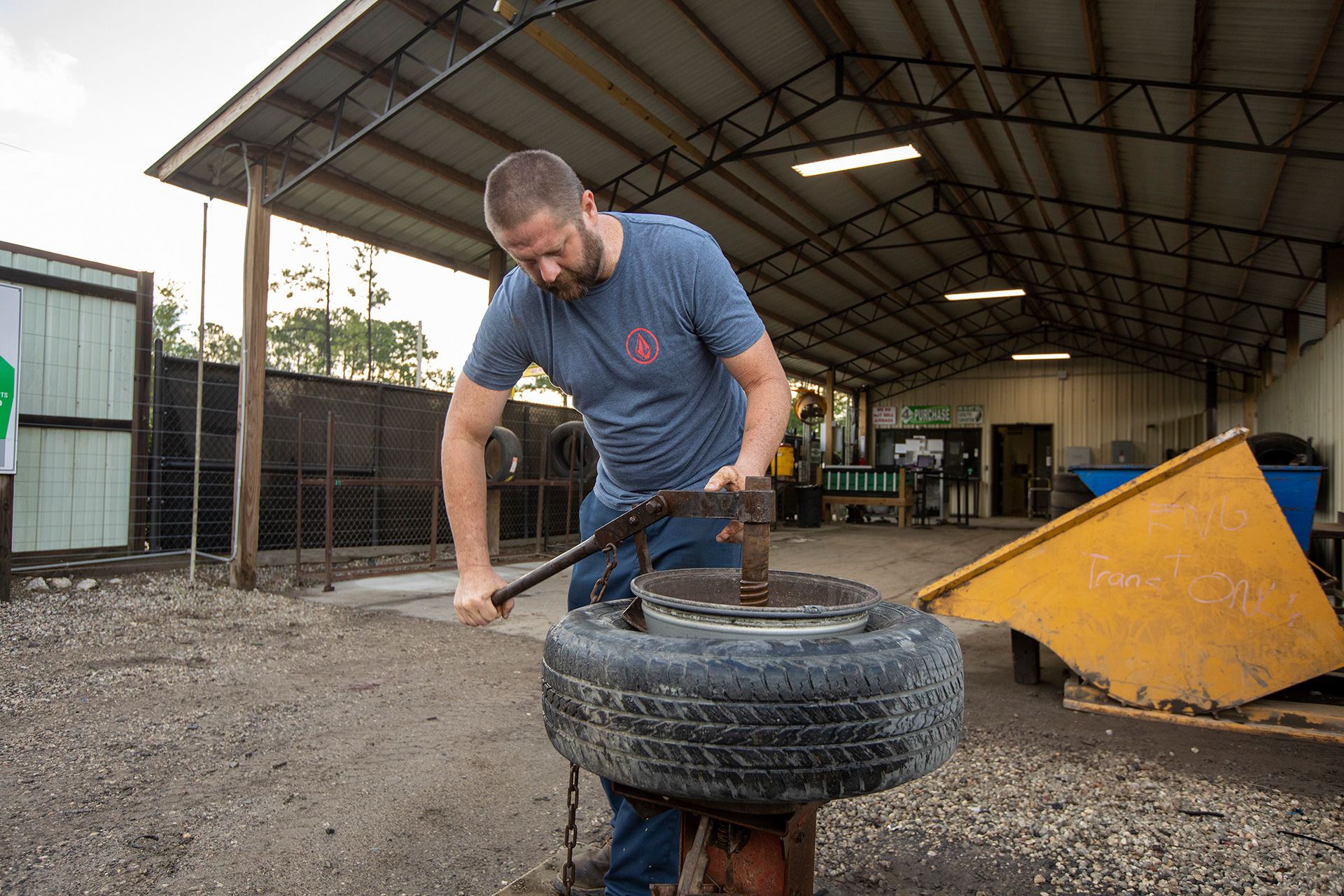 Man taking tire off rim